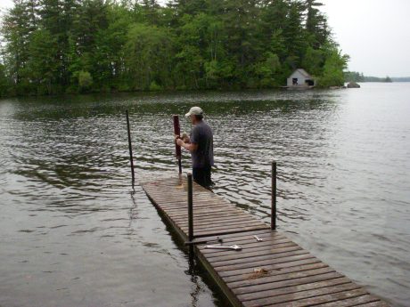 Uncle C setting up mainland dock across from the island